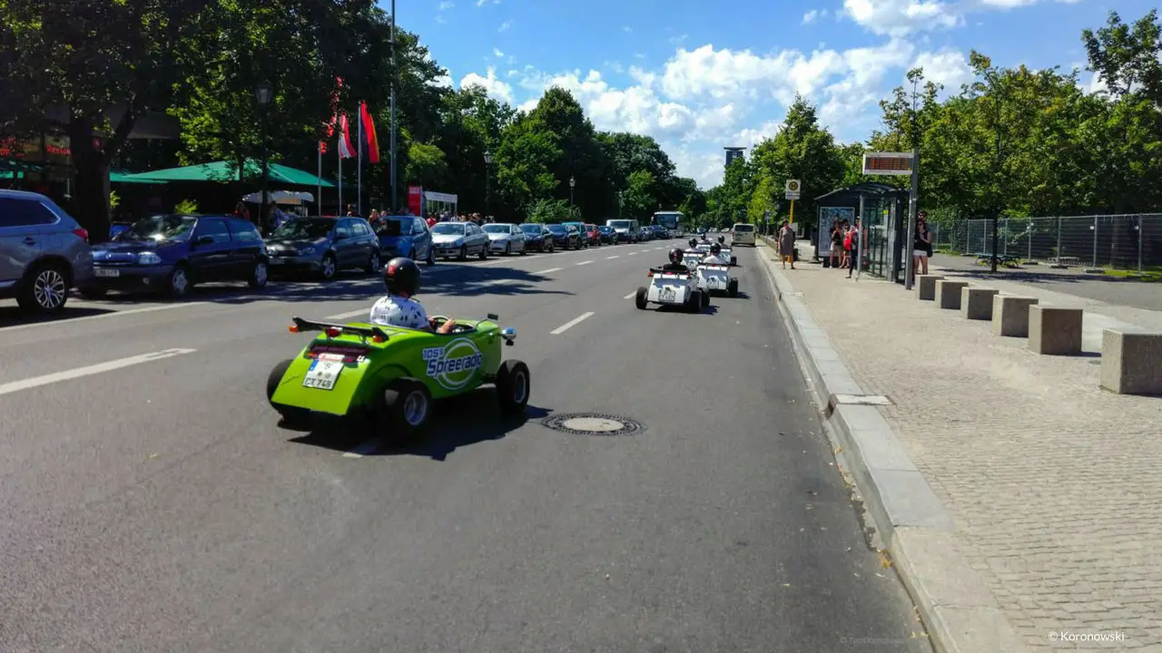 A convoy of mini hot rods on a city tour through Berlin.